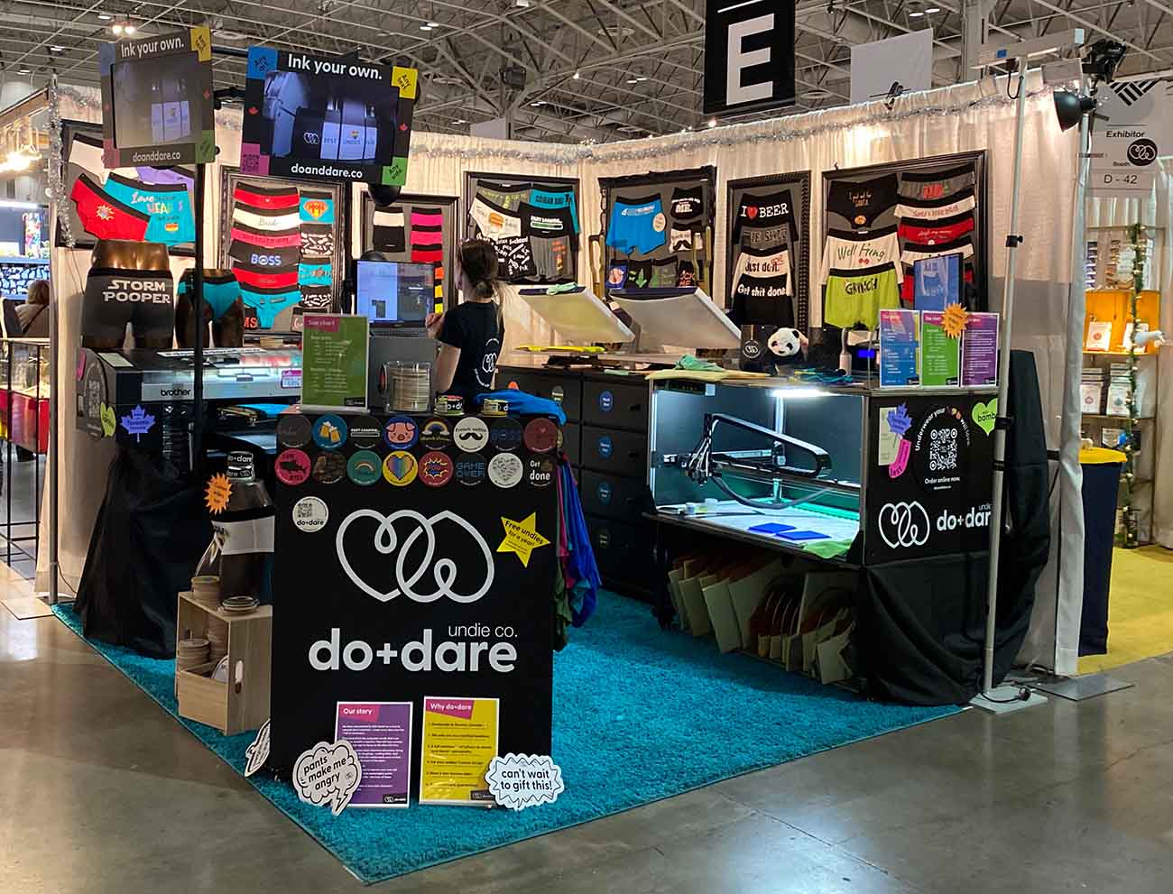 do+dare undie co. booth setup at the one of a kind winter show in toronto - ink on demand