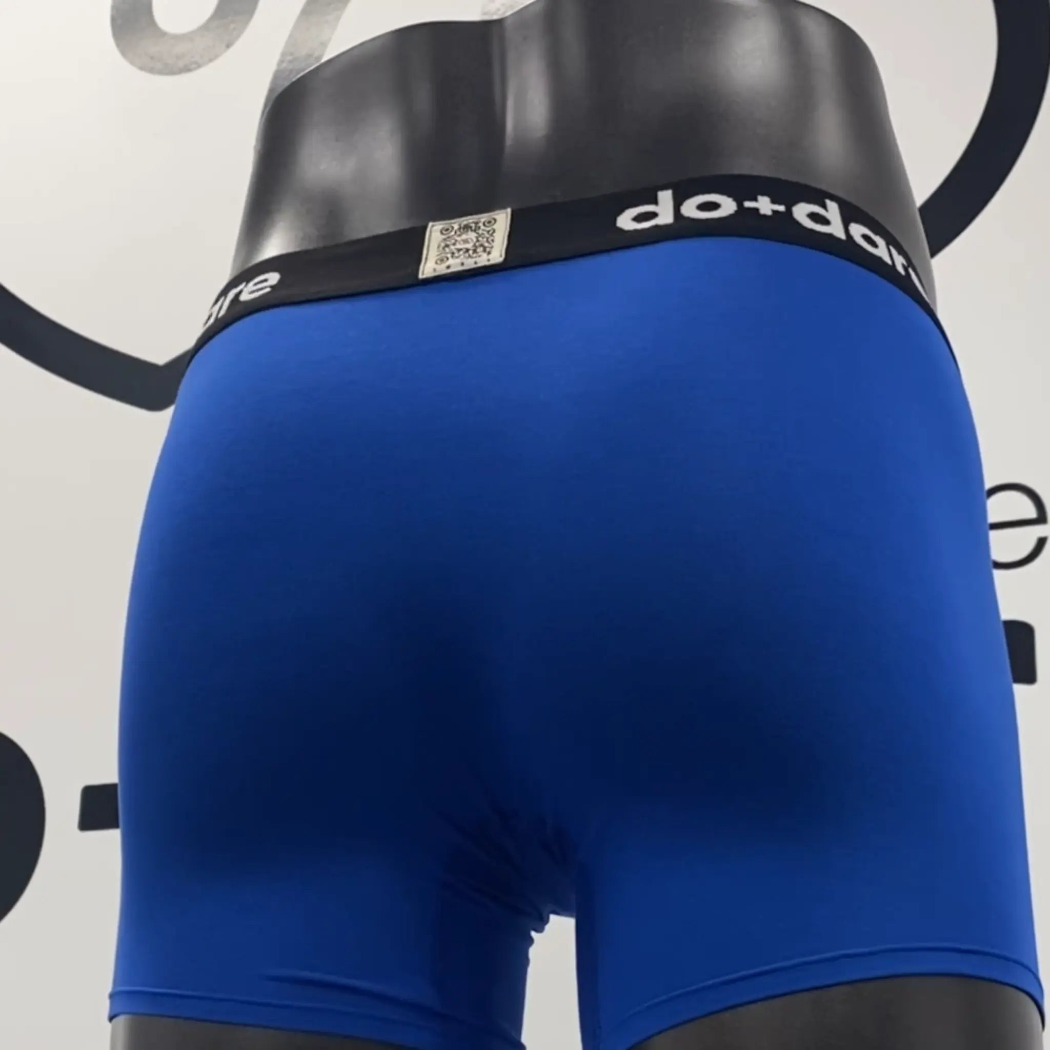 Blue boxer briefs with a black waistband featuring &